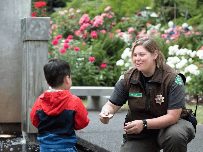 Officer talking with a child in the community